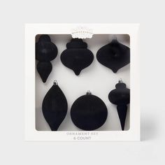 an ornament set in a box with black ornaments