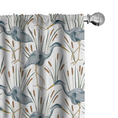 a white curtain with blue birds and reeds on it