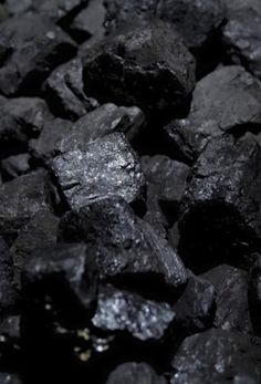 black coal is shown in this close up shot, with no one around it looking at the camera