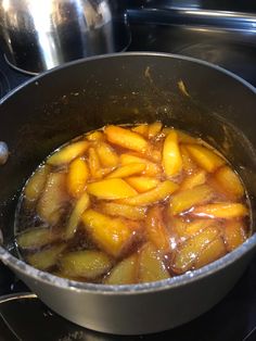 the food is being cooked in the pot on the stove top and ready to be eaten