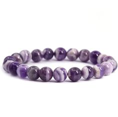 This Chevron Amethyst Gemstone Bracelet is crafted with beautiful stones carefully sourced from nature and hand-strung together with love. This bracelet provides healing benefits, balancing energy flow and promoting relaxation with its delicate yet powerful Amethyst stones. Amethyst Gemstone Beads Bracelets As Gift, Amethyst Gemstone Beads Bracelet For Gifts, Amethyst Gemstone Beads Bracelet As Gift, Stretch Bracelet With Round Beads Stones As Gift, Round Crystal Bead Bracelet As Gift, Purple Beaded Bracelets With Stones For Gifts, Amethyst Beaded Bracelets With Round Beads, Purple Beaded Bracelets With Stones As A Gift, Hand-strung Crystal Bracelet For Gifts