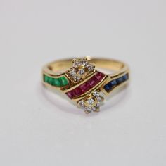 SKU: 0060 A beautiful 18ct yellow gold fancy ring featuring diamonds, rubies, emeralds and sapphires. This pretty ring would be perfect for any and every occasion. Size: UK: L 1/2 American: 6 Continental: 11 1/2 This is a vintage item and such has wear. There may be some superficial scratches, otherwise the item is good condition. This item comes beautifully boxed in our own packaging. Processing time for orders is 1-3 business days. Multicolor Ruby Ring For Anniversary, Fine Jewelry, Multicolor Ruby Ring For Anniversary, Elegant Multicolor Ruby Ring With Diamond Setting, Elegant Multicolor Ruby Ring With Diamonds, Multicolor Diamond Ruby Ring For Anniversary, Multicolor Ruby Ring With Diamonds For Anniversary, Multicolor Emerald Ring For Anniversary, Pretty Ring, Fancy Rings