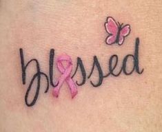 a pink ribbon and butterfly tattoo on the back of a woman's shoulder that says, messed