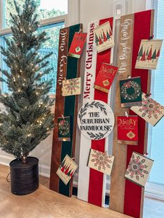 a decorated christmas tree in front of a window