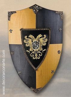 a black and gold shield with an eagle on it