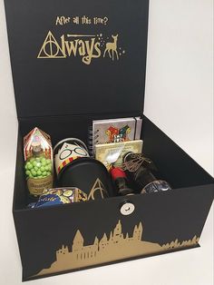 an open harry potter box with items inside