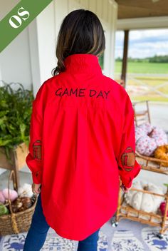 Cheer your team to victory in our Preppy Gameday Top! This button down top features fun football patches on the elbow, adding a touch of sporty charm to your outfit. Perfect for showing off your team spirit in a playful and stylish way!! You can choose to pop the collar for an ultra chic, preppy look or fold it down. Oversized fit One size fits most (fits sizes 4-14 best) Kristen is 5' 4" (a small-medium in tops and size 7/8 in bottoms) Varsity Tops With Team Name For Game Day, Varsity Tops For Game Day, Casual Game Day Tops In Team Colors, Casual Team-colored Tops For Game Day, Varsity Team-colored Tops For Game Day, School Spirit Tops With Mascot For Sports Events, Varsity Style Tops For Game Day, Casual Tops For Game Day During Football Season, Varsity Style Tops For Football Season Game Day