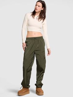 The Takeaway: Crush it in cargos Take this staple from campus to wherever for a casual-cool look. Relaxed fit Two back pockets Two side cargo pockets Adjustable bungee cord at waist and ankle Water resistant Imported Pink Pants Outfit, Parachute Cargo Pants, Parachute Cargo, Crush It, Pink Olive, Fitted Jumpsuit, Denim Sweater, Bungee Cord, Flare Leggings