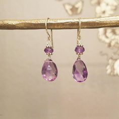 A real show-stopper, our Small Gem Earrings feature hand selected gemstone briolettes, adding a pop of color that's easy to compliment! The simple styling makes these very wearable while the vibrant gemstones are sure to garner lots of attention! Handcrafted in 14k gold fill or sterling silver Approximate 1" length including gemstone Secured on our handmade earwires Shown in amethyst and aqua topaz. View our Gem Glossary. Md Hairstyles, Antique Mens Jewelry, Briolette Earrings, Gem Earrings, Buying Jewelry, Victorian Era, Birthstone Jewelry, Jewelry Earrings Studs, Ear Wires