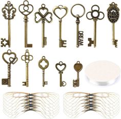 an assortment of antique keys are shown in various shapes and sizes, including heart - shaped ones