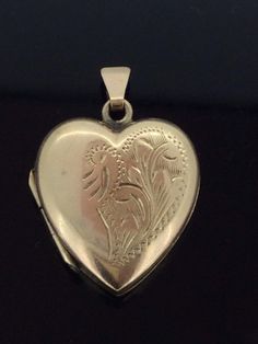 Antique Edwardian Hinged Heart Locket in 9CT hallmarked gold in excellent Condition this pendant is very elegant embossed front patterned and measuring 2.5cm x 1.8cm All pieces are unique I aim to provide you with a 5 star service and 100% customer satisfaction is my priority. All my items are vintage and pre owned so at times they will have signs of age but I try my very best to describe them with accuracy. Your purchase will be carefully packed to protect it. If you wish it wrapped as a gift for someone then do let me know please. SHIPPING U.K.POSTAGE: FREE SHIPPING  Royal Mail Special delivery INTERNATIONAL SHIPPING  FREE SHIPPING WORLDWIDE  ROYAL MAIL I SHIP TRACKED SIGNED AND INSURED BUT IT DOES NOT COVER CUSTOM CHARGES IN YOUR COUNTRY. Traditional Heart-shaped Yellow Gold Jewelry, Classic Double Heart Engraved Jewelry, Classic Engraved Double Heart Jewelry, Heart-shaped Engraved Jewelry For Formal Occasions, Antique Heart-shaped Engraved Jewelry, Antique Etched Heart Jewelry, Antique Etched Heart-shaped Jewelry, Traditional Engraved Jewelry For Valentine's Day, Traditional Gold Heart-shaped Jewelry