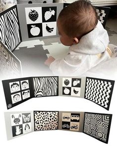 a baby is playing with some black and white artwork