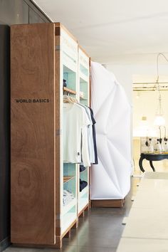 a closet with clothes hanging on it in a room