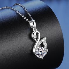 This gorgeous 925 Silver Swan Moissanite Necklace is crafted with the finest quality materials. A shining beauty that will last for years to come, it features 0.8mm moissanite stones and a delicate locket design. With its timeless style and luxurious shine, it's sure to become a beloved piece of jewelry. Product Details: Material: 925 Sterling Silver Stone: Moissanite Diamonds/D /1 carat Weight: about 3.12g Length: 45cm Pendant Diamond Height: 6.5mm SKU: AN23102312 Keywords: moissanite chain, mo Diamond Pendant Jewelry, Silver Swan, Locket Design, Moissanite Necklace, Fine Jewelry Gift, Diamond Pendant Necklace, 1 Carat, Moissanite Diamonds, 로고 디자인