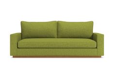 a green couch sitting on top of a white floor