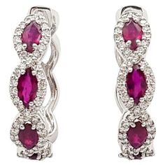 Ruby 1.65 carats with Diamond 0.65 carat Earrings set in 18K White Gold Settings Width: 0.5 cm Length: 2.2 cm Total Weight: 9.09 grams "We first opened doors in 1980 when it was then situated in the vicinity of the Victory Monument; a small and modest storefront with a couple of counters. From its humble beginnings to where it stands today, our company has proven its abilities as a jeweler. Since the beginning, we have been supplying fine quality pieces to dealers, wholesalers and customers worl White Gold Set, Humble Beginnings, Ruby Diamond, Gold Set, Jewelry Earrings Hoops, Earrings Set, Earring Set, Monument, Diamond Earrings