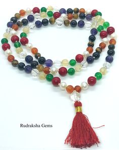 Welcome, Namaste --------- Description PLANETARY NAV RATNA JAPA MALA SIZE OF BEADS : 7 MM NUMBER OF BEADS : 108 +1 ( + ROCK CRYSTAL SPACER bead after 54 bead for Planetary perfect formation) LENGTH OF MALA :86CM APPROX MADE WITH TRADITIONAL STYLE WITH KNOTS AFTER EACH BEADS PREMIUM QUALITY This rare mala consists of 9 semi-precious stones, each one representing a planet of the solar system. Stones include carnelian (Sun), pearl (Moon), coral (Mars), aventurine (Mercury), citrine (Jupiter), quart Adjustable Multicolor Crystal Necklace With 8mm Beads, Spiritual Round Beaded Necklace With Colorful Beads, Multicolor Crystal Necklaces With 8mm Round Beads, Multicolor Polished Beaded Bracelets For Meditation, Multicolor Polished Beads Bracelet For Meditation, Multicolor Oval Bead Necklaces 8mm, Multicolor Necklaces With 8mm Oval Beads, Spiritual Polished Round Beads Crystal Necklaces, Multicolor Oval Beads Necklace With 8mm Beads