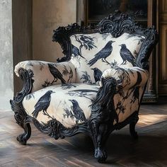 a black and white chair sitting on top of a hard wood floor