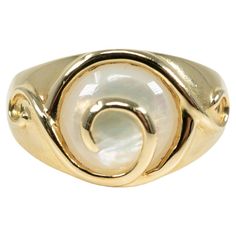 In 14 karat yellow gold, this ring is centered with one circular mother-of-pearl inlay. Modern Gold Opal Ring With Polished Finish, Yellow Gold Polished Moonstone Ring, Formal Polished Opal Ring, Classic Mother Of Pearl Round Rings, Classic Mother Of Pearl Rings, Classic Yellow Gold Moonstone Ring With Polished Finish, Classic Formal Rings With Mother Of Pearl, Elegant Mother Of Pearl Round Rings, Classic Mother Of Pearl Ring For Formal Occasions