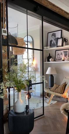 a living room filled with furniture and lots of windows