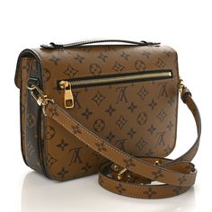 This is an authentic LOUIS VUITTON Reverse Monogram Pochette Metis. This handbag is crafted of classic and reverse Louis Vuitton monogram on coated canvas in brown and beige. The bag features a rear zipper pocket, a black leather top handle, and a removable adjustable reverse monogram canvas shoulder strap. The crossover flap opens with a polished gold-toned S-lock to a partitioned black microfiber interior. Louis Vuitton Monogram Bag, Louis Vuitton Pochette Metis, Louis Vuitton Crossbody Bag, Black Leather Top, Louis Vuitton Crossbody, Louis Vuitton Empreinte, Louis Vuitton Vernis, Embroidered Monogram, Brown And Beige