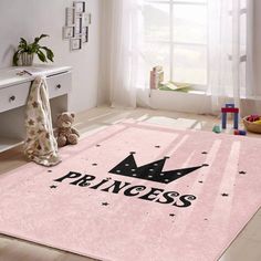 a pink rug with a black princess crown on it