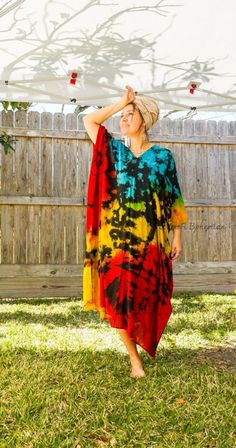 "Add a touch of unique style to your wardrobe with our Hand-Dyed Kaftan Dress! This stunning dress is made from 100% breathable and comfy rayon fabric, ensuring maximum comfort all day long. Using our unique method, each dress is carefully hand dyed, resulting in a one-of-a- kind masterpiece. The intricate patterns and vibrant colors make this dress a true work of art. The kaftan dress comes in a versatile one size fits most (S-3XL), making it extremely comfortable for a wide range of body types. With a bust measurement of up to 60\", you can feel confident that this dress will flatter your figure. The dress measures 55\" in length and 45\" in width, providing a loose and flowing fit that is both stylish and flattering. Featuring a trendy V-neck design and side slits, this slipover style d Hand Dyed Multicolor Dresses For Festival, Hand Dyed Multicolor Dress For Festival, Bohemian Multicolor Dresses With Natural Dye, Multicolor Hand Dyed Bohemian Dress, Beach Hand-dyed Multicolor Dresses, Tie Dye Clothing, Dress Loose Fit, Tie Dye Outfits, Dye Dress