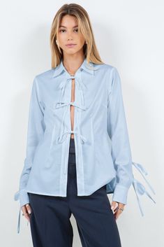 Chambray Bow Tie Details Shirt Cotton Shirt With Tie Sleeves And Long Sleeve, Long Sleeve Shirt With Tie Sleeves For Workwear, Chic Button-up Top With Tie Sleeves, Chic Tie Sleeves Button-up Tops, Fitted Long Sleeve Top With Tie Sleeves, Blue Long Sleeve Tops With Tie Sleeves, Spring Workwear Top With Spread Collar, Spring Cotton Shirt With Tie Sleeves, Spring Long Sleeve Tops With Tie Sleeves