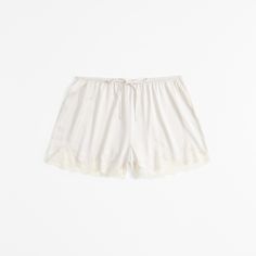 Indulge in the luxurious comfort of Abercrombie & Fitch's Lace and Satin Sleep Shorts, designed to enhance your nighttime routine. These elegant shorts combine the silky smoothness of satin with the delicate allure of lace, making them a must-have in your sleepwear collection.

- **Size**: Medium
- **Color**: Cream
- **Material**: Body - Polyester, Elastane; Lace Detail
- **Gender**: Female
- **Age Group**: Adult

Crafted with an elasticated drawstring waistband, these shorts offer a perfect fit White Lace Trim Sleep Bottoms, Feminine Pajama Shorts For Summer Bedtime, Feminine Pajama Shorts For Bedtime In Summer, Feminine Summer Pajama Shorts For Bedtime, Cotton Pajama Shorts With Lace Trim, Cotton Lace Trim Shorts For Daywear, Cotton Pajama Shorts With Lace Trim For Spring, Cotton Shorts With Lace Trim For Daywear, Daywear Pajama Shorts