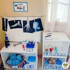 two white shelves with toys on them in a room