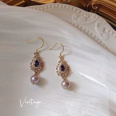 Exquisite luxury round purple pearl 14K gold lace dangle earrings, with gorgeous teardrop violet amethyst gemstone paved. Breath-taking elegant and delicate earrings, vintage luxurious accent, beautiful and unique. Handcrafted jewelry, top quality dainty earrings, one of the kind piece of art. Featuring lustrous purple pearls set in a delicate gold lace design, these earrings are perfect for any occasion, from a night out on the town to a formal event. The unique combination of purple pearls and gold lace creates a romantic and feminine look that is sure to turn heads. Our Purple Pearl Gold Lace Dangle Earrings make a perfect gift for a loved one or a treasured addition to your own jewelry collection. With their timeless design and high-quality materials, these earrings will be a cherished Elegant Crystal Jewelry, Baroque Earrings, Drop Pearl Earrings, Pearl Amethyst, Teardrop Diamond, Pretty Accessories, Lace Earrings, Gothic Accessories, Purple Pearl