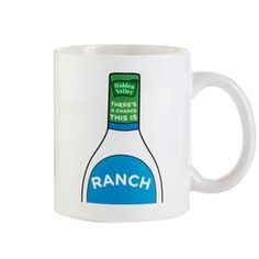 a white coffee mug with an image of a bottle of ranch on the front and bottom