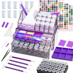 an assortment of crafting supplies including plastic containers