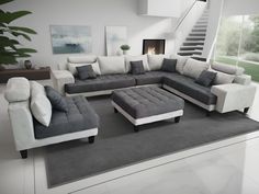 a modern living room with grey and white furniture