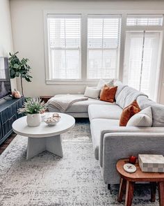 a living room filled with furniture and a flat screen tv