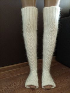 High socks are knitted from angora with the addition of nylon (for durability). Angora yarn is made from angora rabbit down, so the socks are very soft and delicate. These long socks are warm, cozy and fluffy. Look how These socks can be called stockings) You can wear them when doing household chores or when watching TV on the couch. You will look very impressive! Dress them in bed and you will be warm, soft and cozy. I knit with premium quality yarn. The fingerless socks are suitable for yoga d Winter White Knee-high Stockings, White Knee-high Winter Stockings, Comfortable Warm White Knee-high Socks, White Knee-high Comfortable Leg Warmers, Comfortable White Knee-high Leg Warmers, White Warm Knee-high Socks, Warm White Knee-high Socks, Soft White Knee-high Socks For Winter, Cozy Thick White Socks