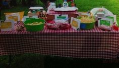 a picnic table with food and decorations on it