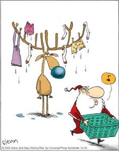 santa claus is pushing a shopping cart with clothes hanging on the line above him and an antelope