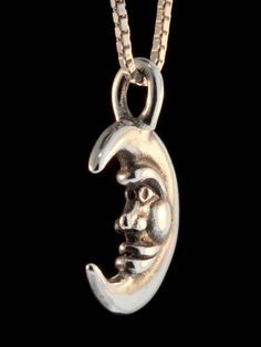 This smiling Moon Charm is cast in sterling silver. It is 7/8 inch high and fully detailed both front and back. All Marty Magic Charms and Pendants include an 18 inch (46cm) box chain. If you would prefer a different length of chain please feel free to contact me. This item usually ships the same or next business day. All Marty Magic Jewelry is packaged in a beautiful box, embossed with the gold foil Marty Magic dragon logo. Perfect for any occasion. Designed in Santa Cruz, California by Marty M Silver Moon Jewelry With Sun And Moon Design, Sterling Silver Crescent Jewelry With Polished Finish, Silver Half Moon Jewelry Engraved, Silver Half Moon Engraved Jewelry, Silver Oxidized Moon Shaped Jewelry, Engraved Sterling Silver Crescent Jewelry, Silver Moon Shaped Symbolic Jewelry, Symbolic Silver Moon-shaped Jewelry, Silver Necklaces With Moon Charm