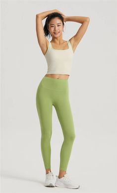 This tank top, made with 80% Nylon and 20% Spandex, is an embodiment of our brand's mission to harmonize yoga, meditation, and energy healing. Designed for everyday loungewear, its contemporary fit is perfect for the spring/summer season. The molded cup feature adds a touch of elegance, making this top a perfect blend of comfort and style. Enjoy the ease of machine wash care instructions. Celebrate your unique journey with this versatile piece from our collection. Green Sleeveless Sports Bra For Yoga, Sleeveless Green Sports Bra For Yoga, Summer Tank Activewear For Pilates, Fitted Tank Activewear For Yoga, Fitted Athleisure Tank Top For Yoga, Compression Tank Top With Built-in Bra For Yoga, Yoga Activewear Tank With Light Support, Compression Moisture-wicking Tank Top For Yoga, Green High Stretch Tank Top For Workout