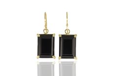 Make a bold statement with these black onyx earrings. Crafted in gold, these earrings feature a rectangle cut black onyx, offering a vintage charm with its 4-prong setting. The black onyx is known for its powerful energies, making these earrings not only a fashion statement but also a token of strength. Dangling beautifully, they will add a touch of refinement to any ensemble. Black Onyx Rectangle Cut Statement Piece Ensemble Match Dangle Style Product specifications Jewelry Information Metal st Formal Black Jewelry With Rectangular Shape, Black Rectangular Jewelry For Formal Occasions, Classic Formal Earrings With Rectangular Stone, Classic Black Rectangular Jewelry, Black Rectangular Earrings For Formal Occasions, Elegant Black Square Jewelry, Formal Black Rectangular Earrings, Classic Rectangular 14k Gold Earrings, Classic 14k Gold Rectangular Earrings