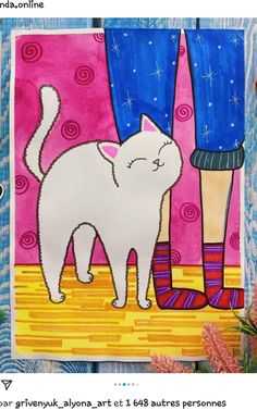 a white cat standing next to a person's legs