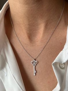 Get this stylish key to keep your high energy 🔑 Get this beautiful minimalist jewelry made with the quality of perfect elements✨ You can choose 925K Sterling Silver with the options of Gold, Rose Gold or White Gold colors. High quality jewelry for everyone 🤍  Details * 925K Sterling Silver Option → 14K Gold, Rose Gold or White Gold plated * Chain length is approximately 18 inches (16+2 in extender) / 45 cm (40+5 cm extender) * Time is everything! You will receive your package as soon as possible 🚚  * We care about the quality of metal to make sure it will last for a long time * We use enamel technique to color the jewelry and high quality zircons only * There can be tiny differences on each item. Length difference of the chain as well as color changes and shade differences of the stones Elegant Sterling Silver Key Jewelry, Elegant Sterling Silver Key Necklace, Elegant Heart-shaped Key Jewelry, Elegant Two Keys Necklace As Gift, Elegant Two Keys Necklace Gift, Elegant Two Keys Necklace For Gift, Time Is Everything, Lock Necklace, Love Jewelry