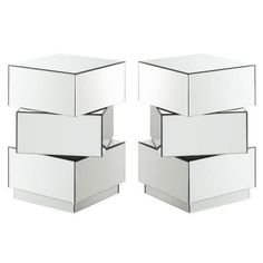 three white boxes stacked on top of each other in the shape of hexagonal cubes