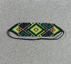 This beautiful beaded necklace is hand-woven by the women of the Embera Chami Indigenous Tribe of Colombia Adjustable Multicolor Rectangular Beaded Necklaces, Bohemian Rectangular Beaded Necklaces For Festivals, Bohemian Adjustable Rectangular Beads, Traditional Handwoven Jewelry, Handmade Bohemian Rectangular Beads, Traditional Handwoven Beaded Necklaces, Traditional Handwoven Choker Jewelry, Traditional Handwoven Festival Beads, Traditional Handwoven Rectangular Jewelry