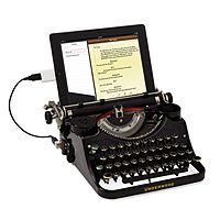 an old fashioned typewriter sitting on top of a tablet