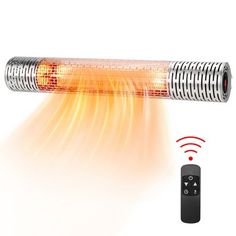 an electric heater with remote control on the side and red light coming from it