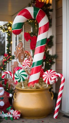 some candy canes and christmas decorations in a pot