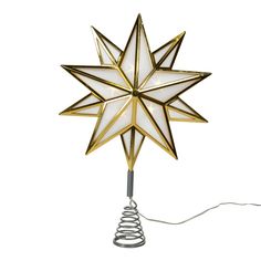 a white and gold star shaped light on a wire