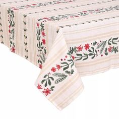 a white table cloth with red flowers and green leaves on the border is shown in front of a white background